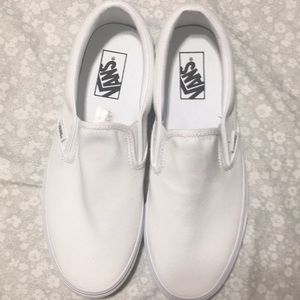 All white slip on vans